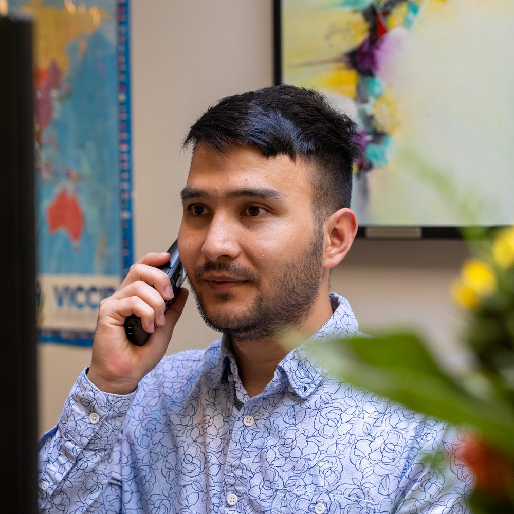 A VICCIR team member answering the phone at the office